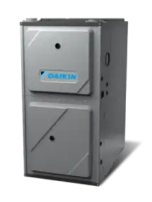 A gray Daikin HVAC furnace unit with two access panels is shown against a plain, light background.
